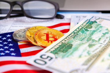 Bitcoin golden coins on a dollar banknotes office background