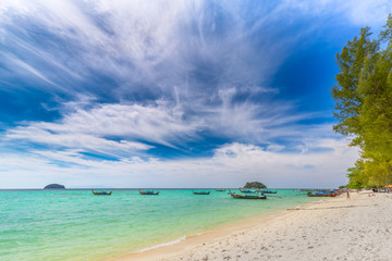 Fototapeta na wymiar Tropical beach paradise and the blue sky at Khai Island in Satun Province , Thailand