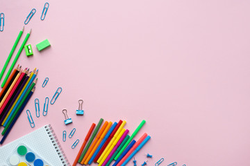 School and office supplies on pink background, back to school