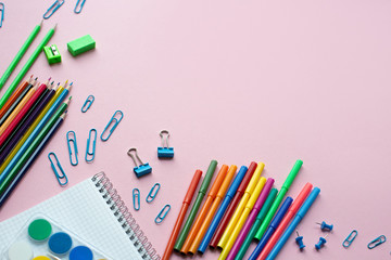 Concept back to school. School supplies on pink background. Copy space