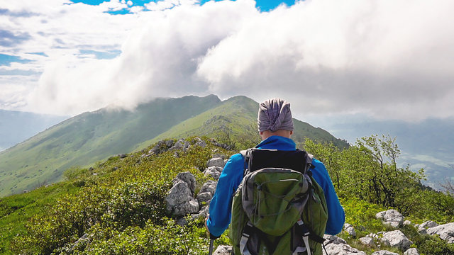 A man hiking on a rocky Mountain
