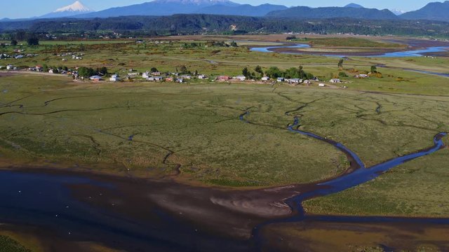 Aerial view of the surroundings of the community of Chamiza in the city of Puerto Montt on a sunny day with few clouds