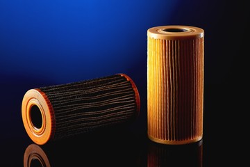 car engine oil filter on dark background