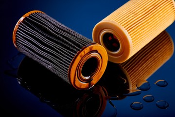 car engine oil filter on dark background