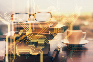 Tech theme hologram with glasses on the table background. Technology concept. Double exposure.