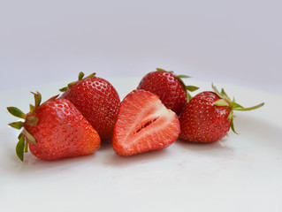 red strawberries on white plate