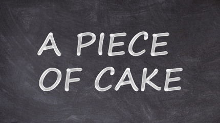 A piece of cake written on blackboard