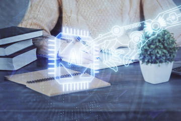 Double exposure of writing hands on background with data solution hologram on front. Technology concept. Close up