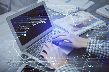 Double exposure of forex chart with man working on computer on background. Concept of market analysis.