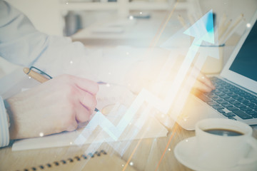 Growing arrows with businessman working on computer on background. Success concept. Double exposure.