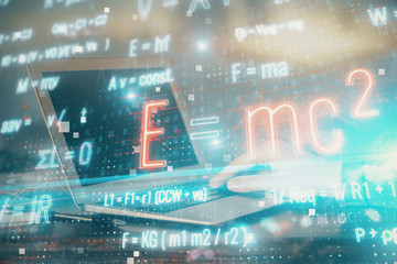 Fototapeta premium Science formula hologram with man working on computer on background. Education concept. Double exposure.