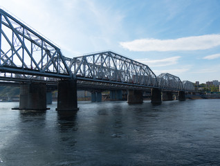 Railway bridge over river in the city