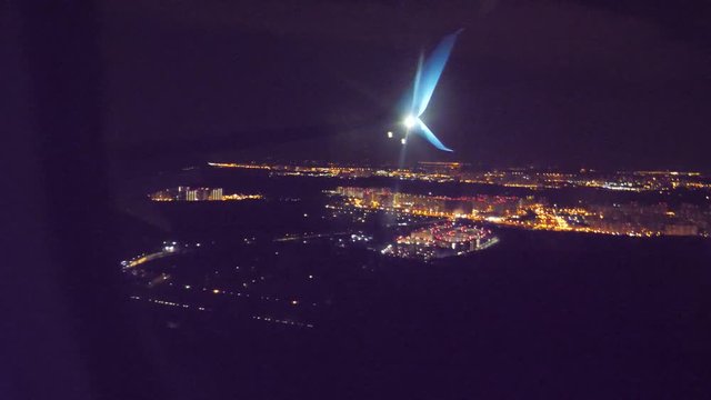 night city view from above. takeoff airplane aircraft flight concept. the plane taking off at night at the airport strip. plane landing. the view from the window of the plane lifestyle you can see the