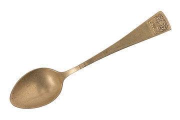 Beautiful old gold vintage teaspoon isolated on white background. Top view. Retro silverware