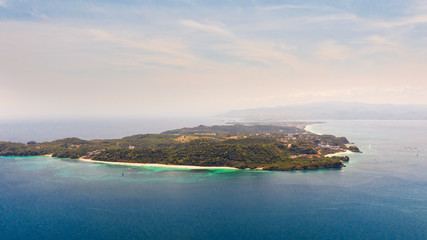 Fototapeta na wymiar Seascape with island of Boracay, Philippines, top view. A large island with urban buildings and white beaches.
