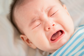 baby lying on the bed