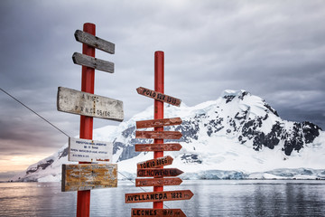 Signposts outside Brown Station along Paradise Harbor in the Antarctic