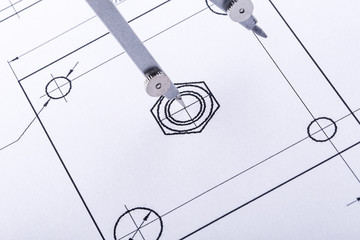 The Compasses  in the drawings. Design and working drawings with compasses. selective focus