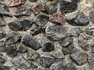 Large stones in concrete texture exterior finishing home
