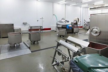 Big steel grinder and other equipment in the meat plant.