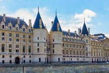 Fototapeta na wymiar View of the Conciergerie castle in Paris, France. It formerly a prison and it was part of the former royal palace. Hundreds of prisoners were taken from the Conciergerie to be executed by guillotine.