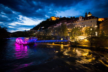 Graz in Austria by night with island in the Mur