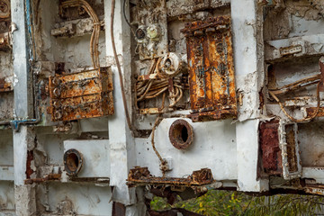 Internal parts of decommissioned marine ship that was cut and left on the shore.