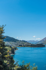 Fototapeta premium View of the landscape of the lake Wakatipu, Queenstown, New Zealand. Copy space for text. Vertical.