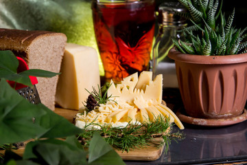 cheese still life. Cheese, sliced and grated cheese on the table