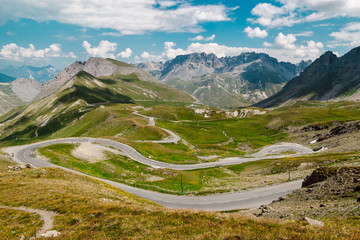 View above a beautiful landscape of valley in Alpine mountains  with serpentine roads. Alpine Road...