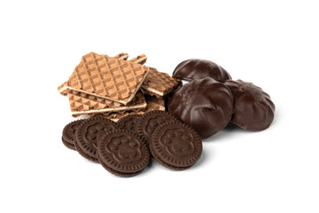 Chocolate cookies, waffles with milk filling and marshmallow isolated on white background.
