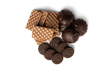 Chocolate cookies, waffles with milk filling and marshmallow isolated on white background.
