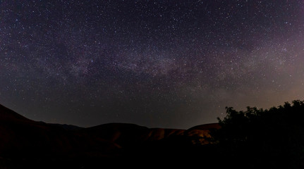 Obraz na płótnie Canvas Panorama of the Milky Way in the mountains