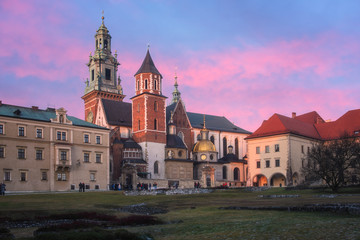 Fototapeta na wymiar Wawel royal castle in Krakow at sunset, medieval fortress, stunning architectural ensemble on the Wawel hill, travel outdoor background, Poland, Eastern Europe