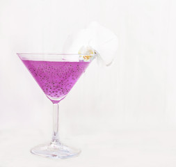 Refreshing healthy drink with chia seeds and white orchid flower. The atmosphere of summer and relaxation. Proper nutrition.