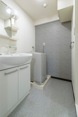 Washbasin and washing machine at the bathroom
