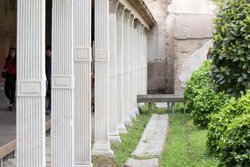 Fototapeta na wymiar Pompeii, Italy - April 21, 2019: archaeological remains of the Columns of the house of Praedia Giulia Felice in Pompeii