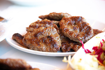 Turkish grilled meatballs on plate.