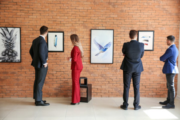 People at exhibition in modern art gallery