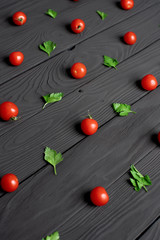 pattern of fresh red cherry tomatoes and parsley leaves