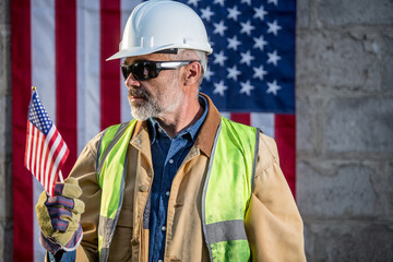 American builder with stars and stripes flag in background