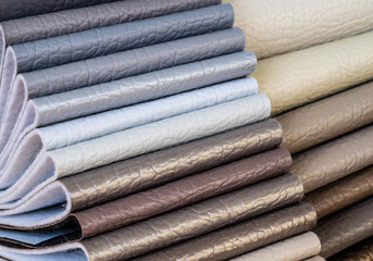 Catalog of multicolored imitation leather from matting fabric texture background, leatherette fabric texture. Industry background. 