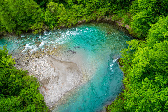 Montenegro, Above turquoise clean clear waters of moraca river bend in moraca canyon surrounded by green forest thicket like jungle