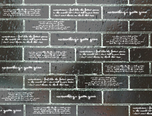 Brick wall with inscriptions, hieroglyphs, with a view of raindrops
