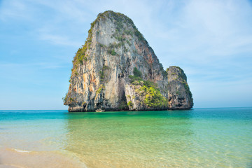 Thailand landscape with tropical sea near sand beach and rock island on foreground and at horizon