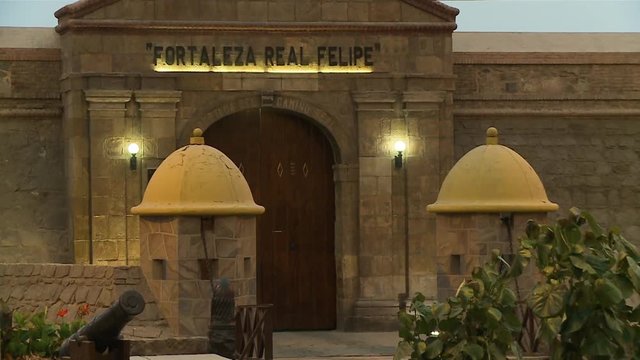 Close up still shot of the outer entrance of Real Felipe Fortress Museum with brilliant door lights, Callao, Lima, Peru.