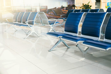 Empty seats in the departure zone. View of airport interoir. Transportation, business travel and vacation theme concept