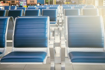 Empty seats in the departure zone. View of airport interoir. Transportation, business travel and vacation theme concept