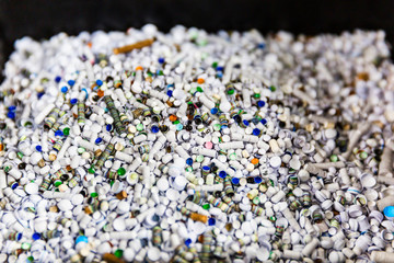 Left over punched holes from plain paper.