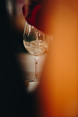 Glass of rose and white wine seen in close hand.